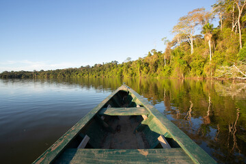 Canoe in the Amazon rain forest river.