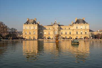 Fototapeta na wymiar Paris, France - 01 15 2022: The Luxembourg Garden. View of Luxembourg Palace reflecting in the waters of the main basin