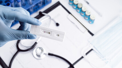 Covid test antigen coronavirus kit. Doctor holding rapid covid medical test. Laboratory hospital...