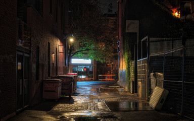 Dark illuminated alley at night - obrazy, fototapety, plakaty