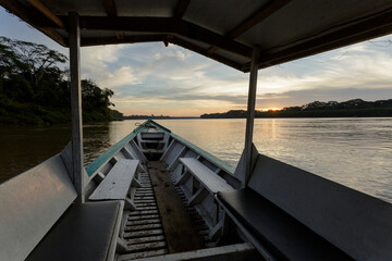 The bow of a boat while sailing on an Amazonian river