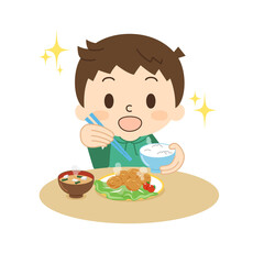 笑顔で食事をする男の子 からあげ