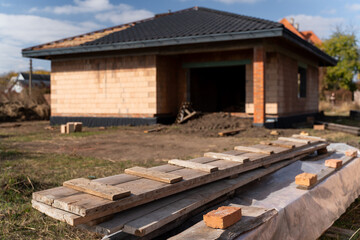 New house constructed in suburban neighborhood. Construction of a new private house settlement. Building of new house