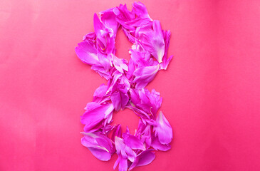 March 8 from flower petals on a white background. congratulations postcard holiday. floral leaves on the table for the holiday .. postcard, congratulations to March 8. women's Day. valentine's day