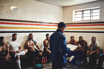 Good teams listen to their coach. Cropped shot of a rugby coach addressing his team players in a locker room during the day.