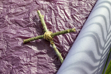 Good Friday, Lent Season and Holy Week concept. A Christian cross  and shadow of palm leaf on...