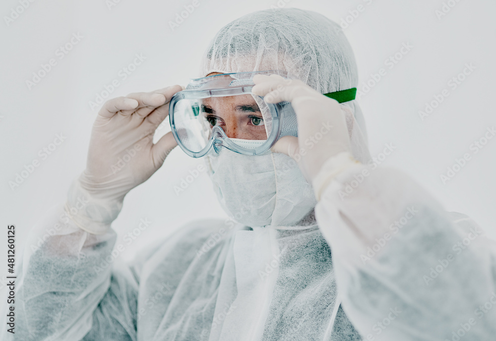 Poster time to get things under control. shot of a young man putting on his protective gear before the deco
