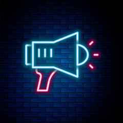 Glowing neon line Megaphone icon isolated on brick wall background. Speaker sign. Colorful outline concept. Vector