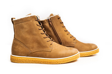 brown leather winter boots with lacing on a white background