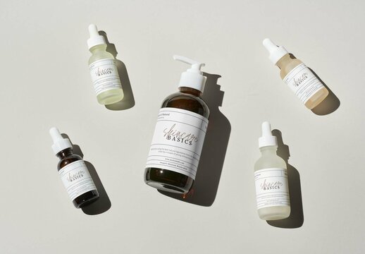 Different Beauty Products Laying on a Grey Surface Mockup