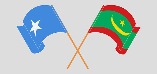 Crossed and waving flags of Somalia and Mauritania