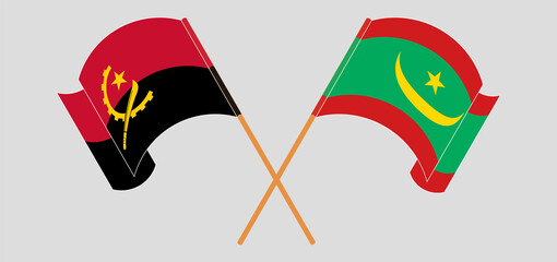 Crossed and waving flags of Angola and Mauritania