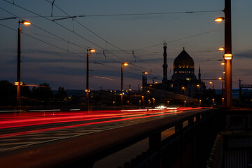 Naklejka na ściany i meble Long time exposure of traffic through Dresden, Yenidze in background