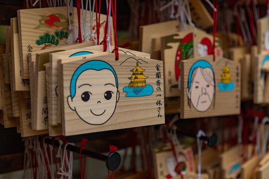 Kyoto, Japan - January 22, 2020: A close-up picture of wooden emas in the premises of the Kinkaku-ji Temple.