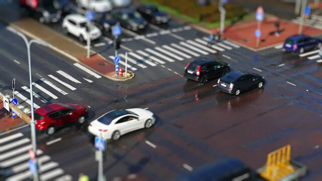 Crossroad with people and cars. Miniature effect.
