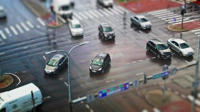 Crossroad with people and cars. Miniature effect.