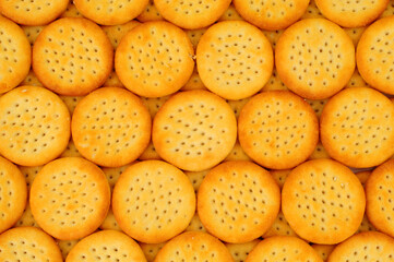 Group of mini cheese flavoured savoury biscuit crackers background