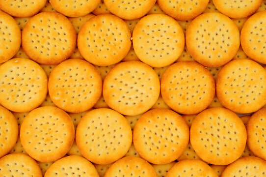 Group of mini cheese flavoured savoury biscuit crackers background