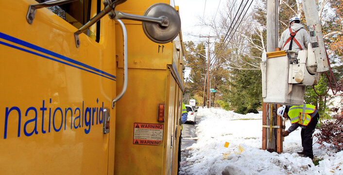 National Grid electric workers repair power lines, two days after an early snowfall in Worcester, Massachusetts
