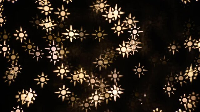 Abstract blurry, low depth of field bokeh light shapes. Vivid, colourful light effects, 4K background video clip with different shapes and dots in various colours. Perfect for Christmas backgrounds