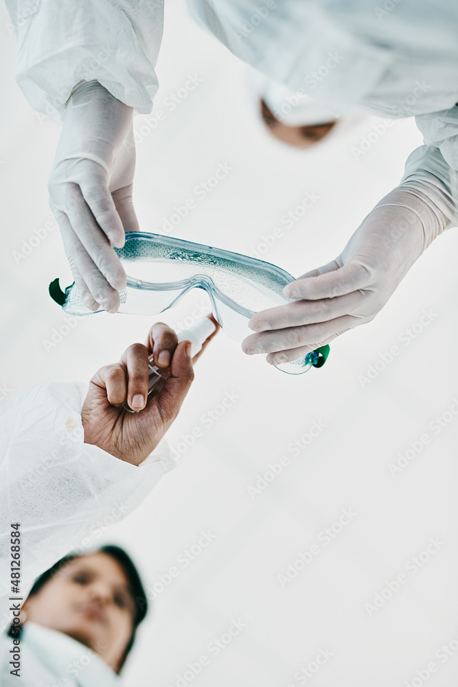 Poster everything we do determines the outcome. cropped shot of two healthcare workers disinfecting themsel