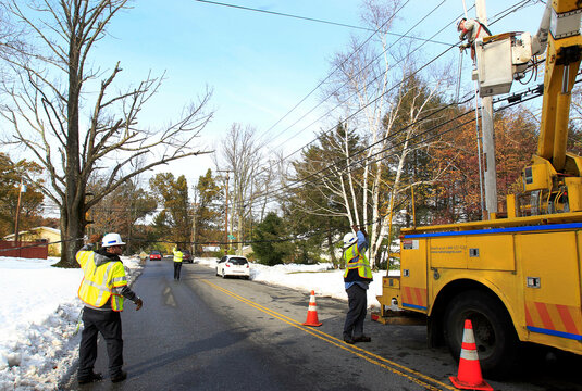 National Grid electric workers repair power lines, two days after an early snowfall in Worcester, Massachusetts