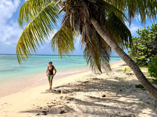 woman standing on tropical beach in Guadeloupe