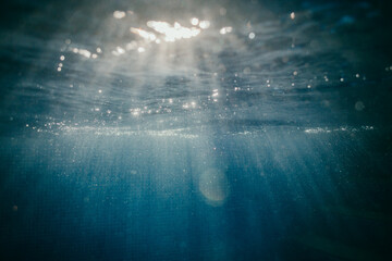 Fototapeta na wymiar Light Through Water in the Pool