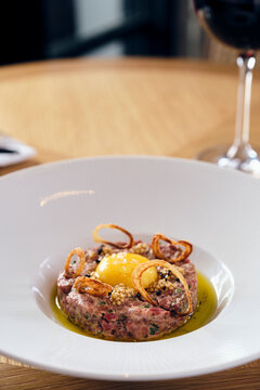 Steak tartare with olive oil, egg yoke and sea salt.
