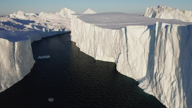 icebergs floating from aerial view in 4k