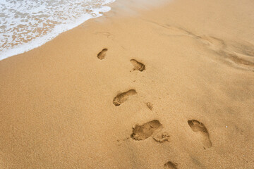 Footsteps on beach