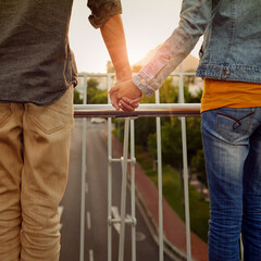 City love. Rearview shot of a couple standing together on a city bridge and looking at the view.