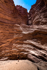 landscape of red mountains with a lady taking photos