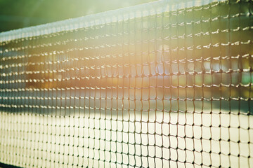 Let the games begin. Closeup shot of a tennis net on a tennis court.