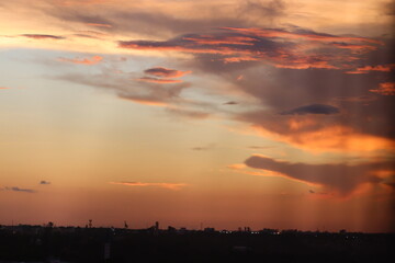 Fototapeta premium Beautiful late afternoon with sunset in colorful sky in shades of pink and orange taken in selective focus and macro photography.