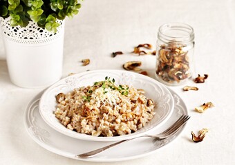 mushroom and barley risotto (Orzotto) - Italian home cooking. barley porridge with mushrooms.