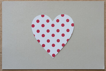 background design with paper heart on silver