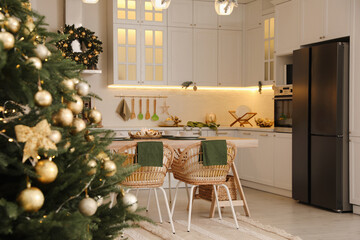 Cozy spacious kitchen decorated for Christmas. Interior design