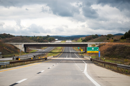 Moorefield, West Virginia Allegheny mountains driving with exit sign car point of view on road to Dolly Sods with cars in traffic on highway and overcast cloudy mist fog sky weather