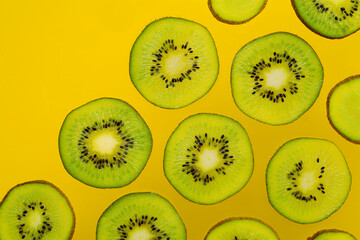 Sliced kiwi fruit with text space for social media or advertisement. Isolated kiwis slices for fruity backdrop.