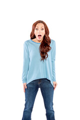 Fototapeta premium A woman with long red hair, wearing a blue and white striped shirt is very surprised.