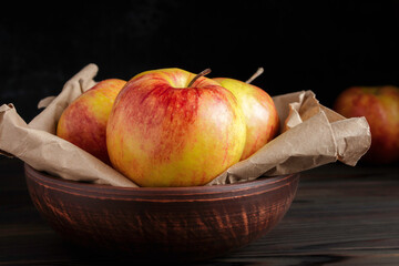 Fresh Gala apples on dark background. Red-yellow apples. Rustic style