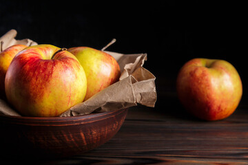 Fresh Gala apples on dark background. Red-yellow apples. Rustic style
