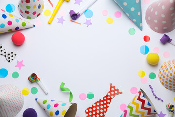 Frame of party items on white background, flat lay. Space for text