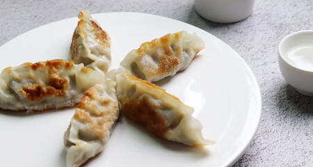 Fried dumplings and liquor. Fried food made with meat and vegetables.
