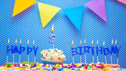 A word from the letters of happy birthday candles for a five year old child. Copy space Happy...