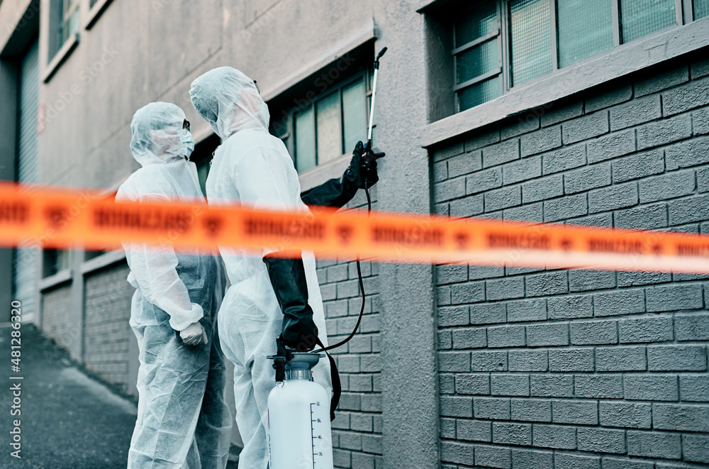 Poster those windows need to be secured. shot of two healthcare workers wearing hazmat suits working togeth