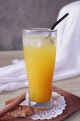 Tamarind turmeric or Kunyit Asam is a traditional Indonesian drink, served with ice cubes, useful for increasing endurance and health. made from tamarind, turmeric extract and sugar