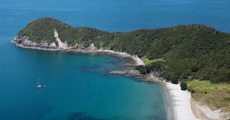 Fototapeta na wymiar New Zealand coastline of beach and island landscape