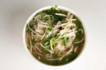 Vietnamese Pho Soup in a bowl on a plain white background
